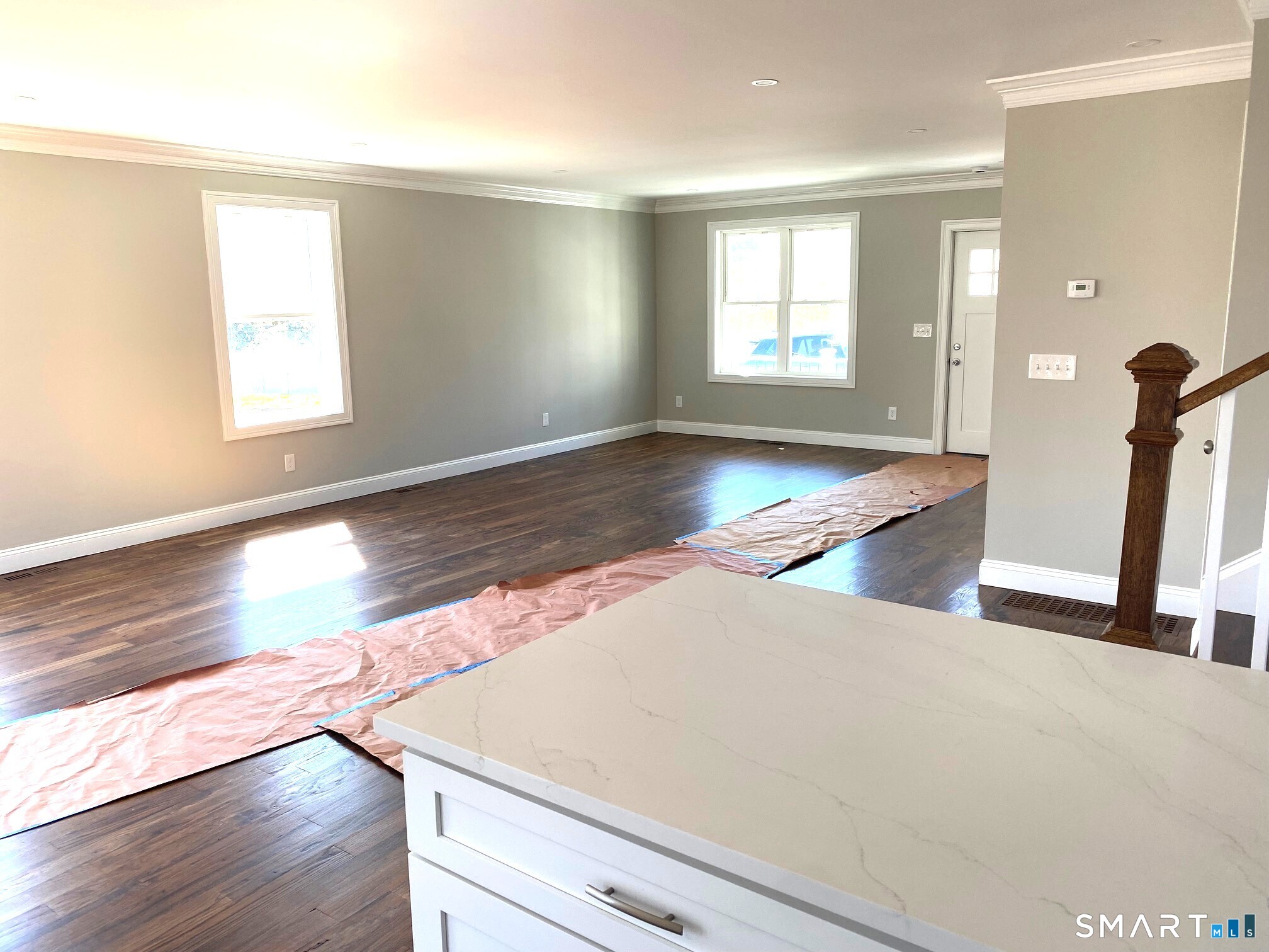 277 Alba Avenue Bridgeport, CT 06606 - Photo 16 of 37 an empty room with wooden floor and windows