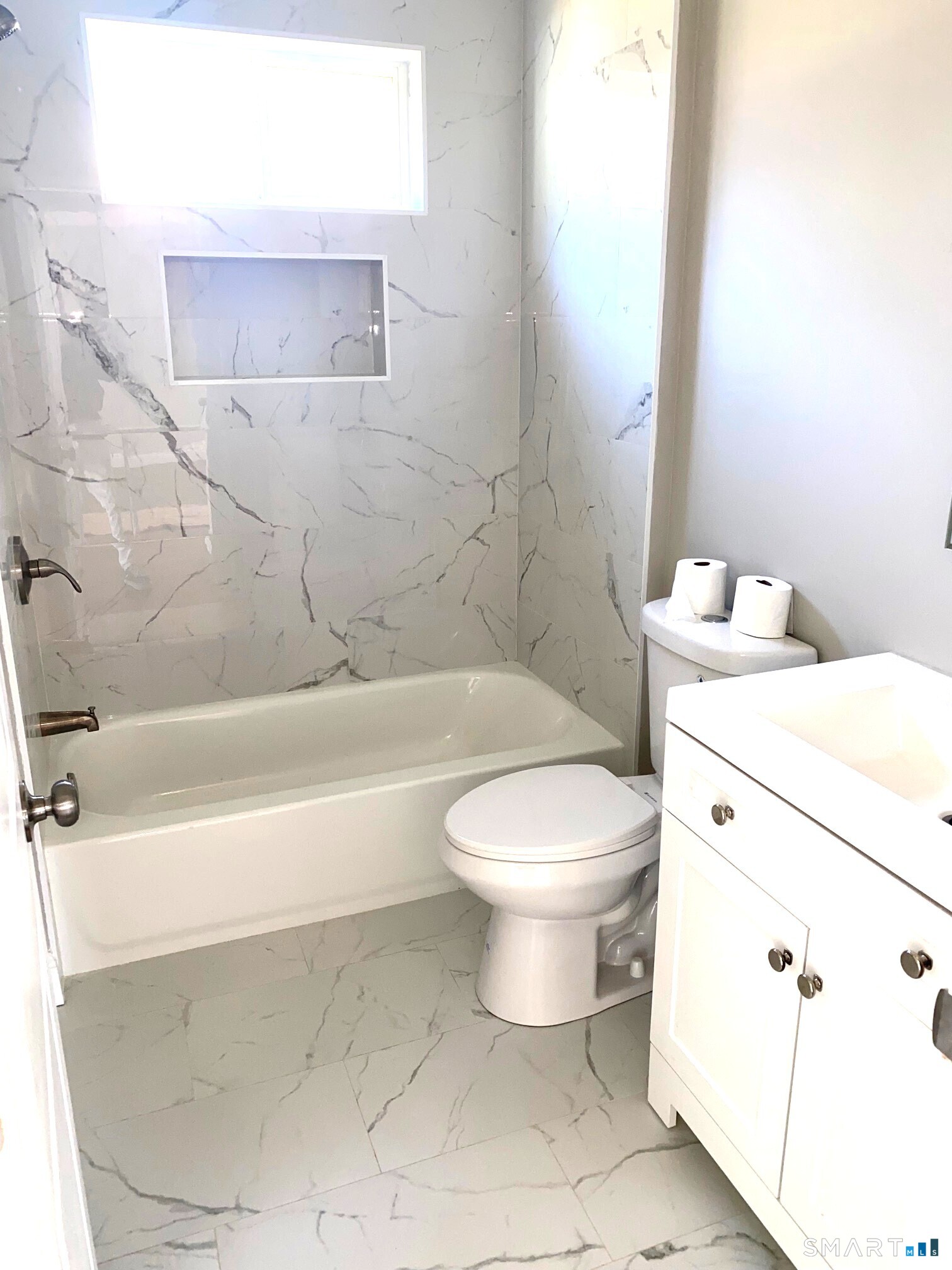 277 Alba Avenue Bridgeport, CT 06606 - Photo 17 of 37 a bathroom with a toilet a sink and bathtub