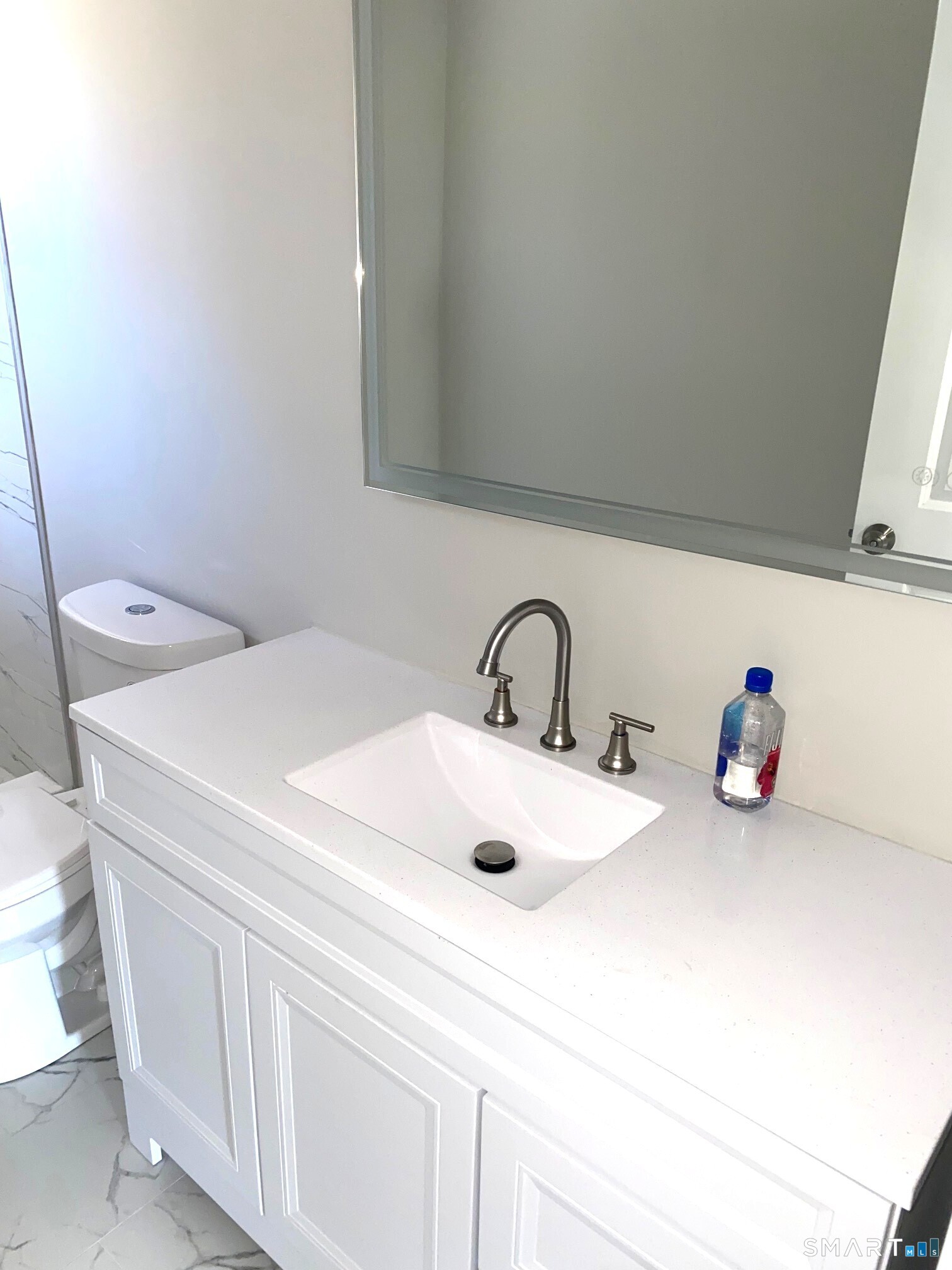 277 Alba Avenue Bridgeport, CT 06606 - Photo 24 of 37 a bathroom with a sink and a toilet