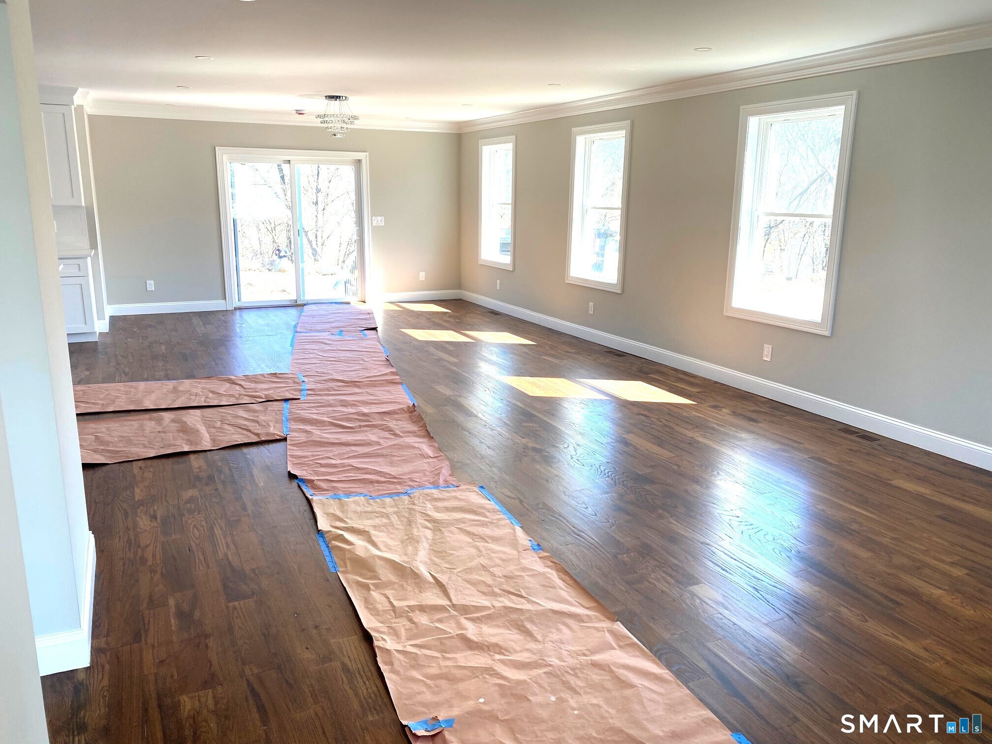 277 Alba Avenue Bridgeport, CT 06606 - Photo 5 of 37 a view of an empty room with wooden floor and a window