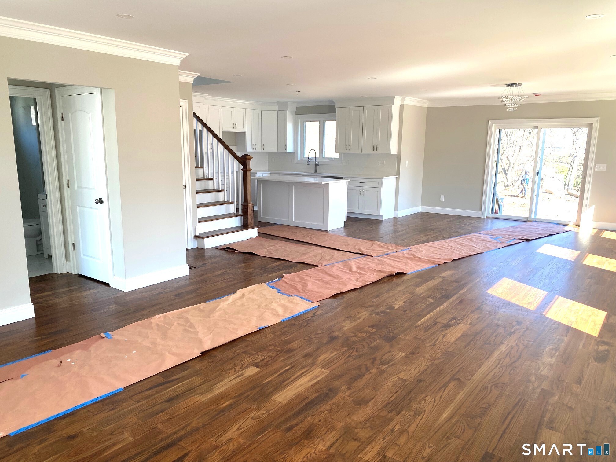 277 Alba Avenue Bridgeport, CT 06606 - Photo 6 of 37 a view of kitchen and hall with wooden floor