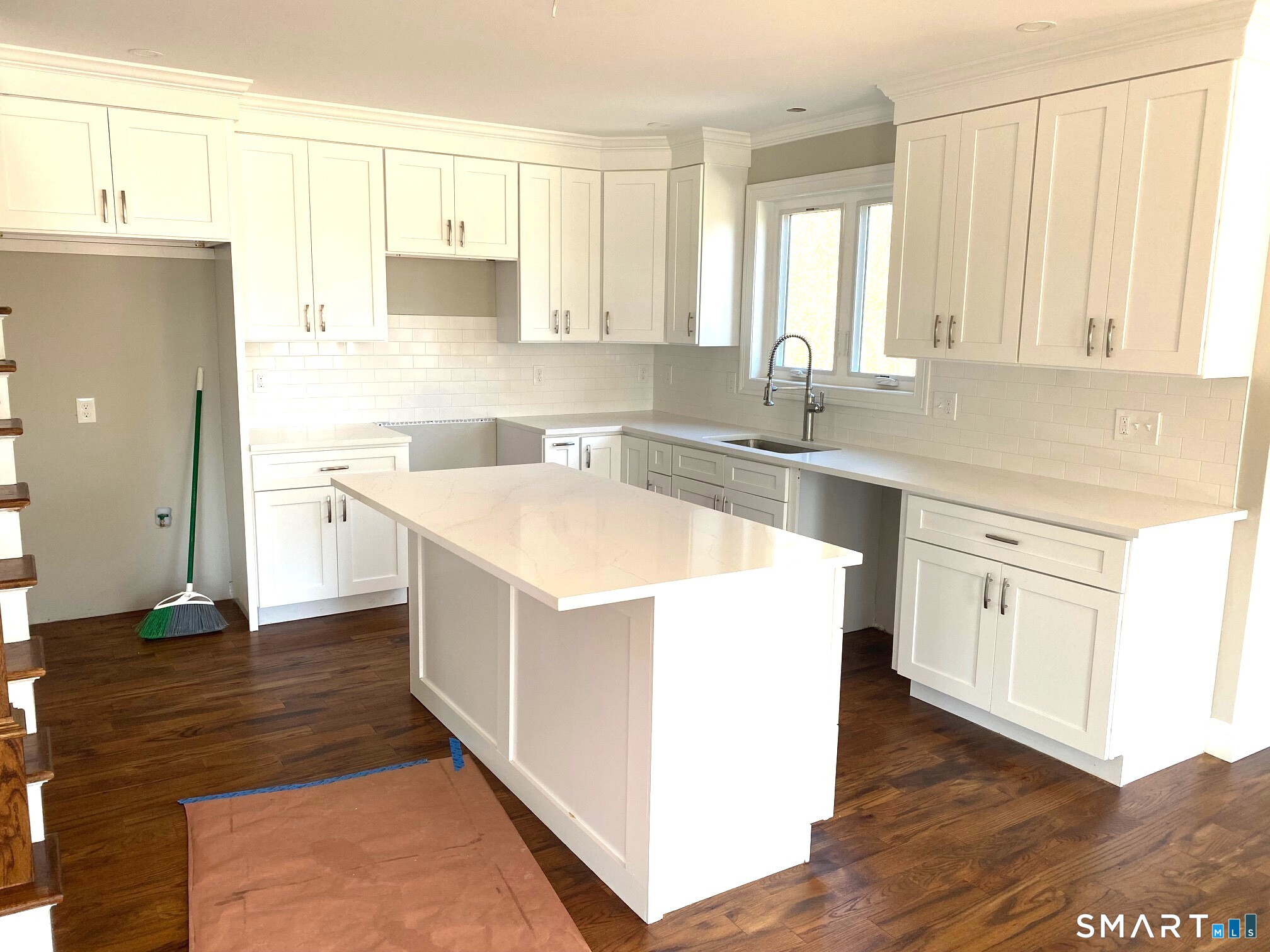 277 Alba Avenue Bridgeport, CT 06606 - Photo 7 of 37 a kitchen with a sink stove and cabinets