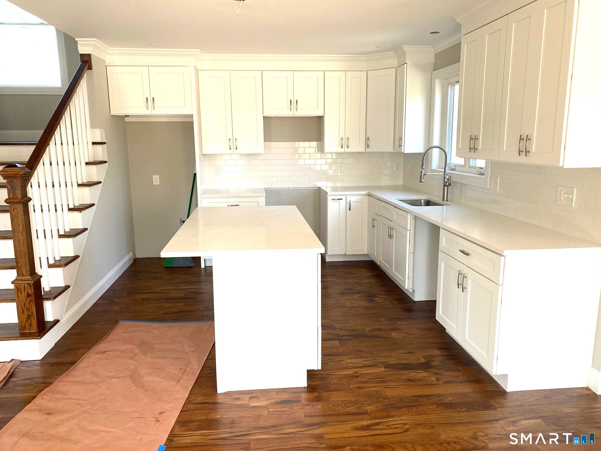 277 Alba Avenue Bridgeport, CT 06606 - Photo 8 of 37 a kitchen with a sink a counter top space and cabinets