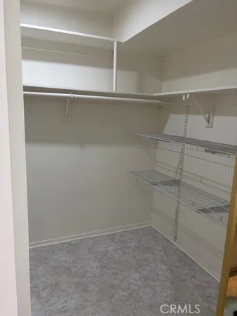 a view of an empty walk in closet