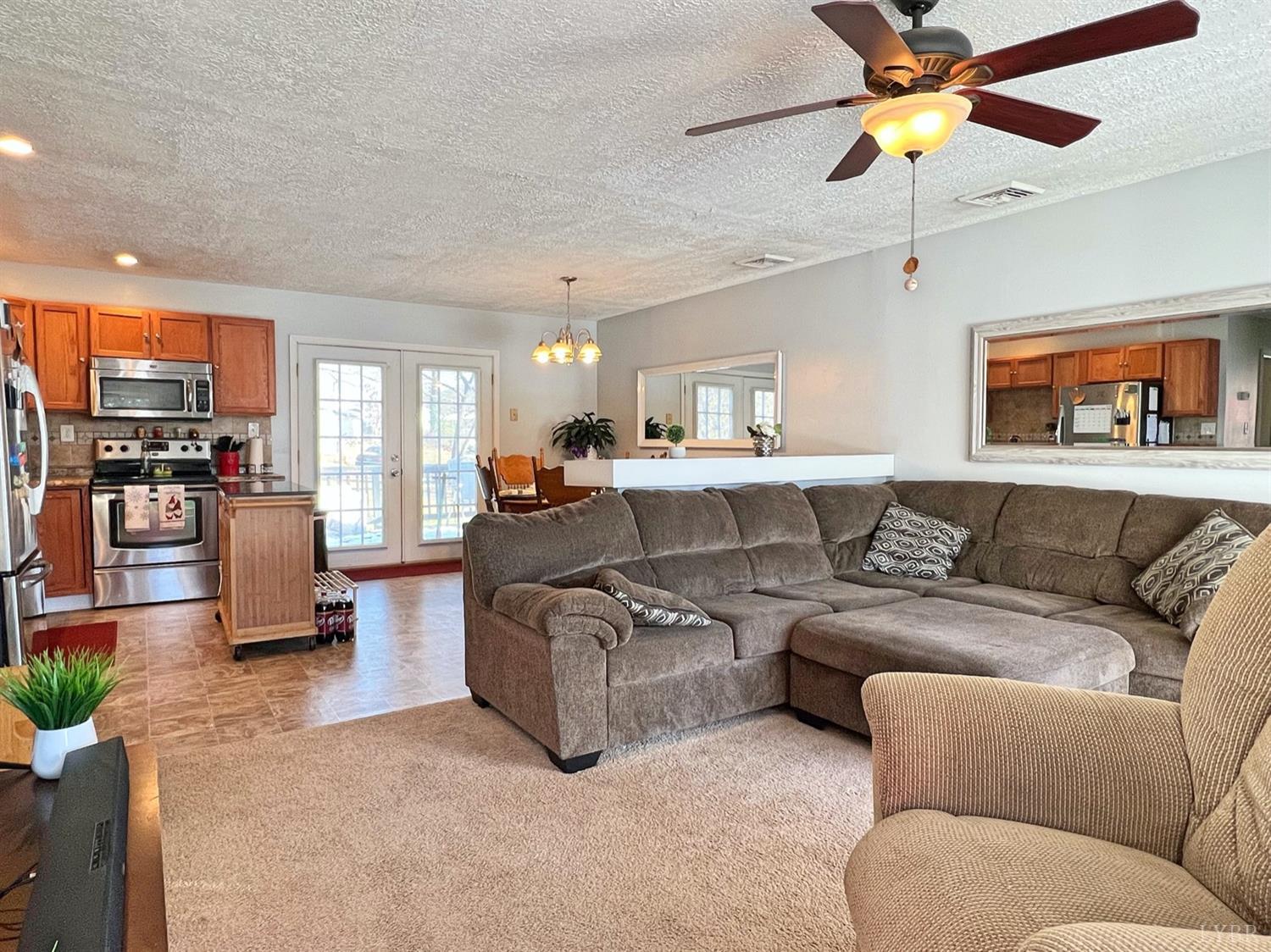 300 Spring Mill Road Concord, VA 24538 - Photo 3 of 30 a living room with furniture kitchen view and a large window