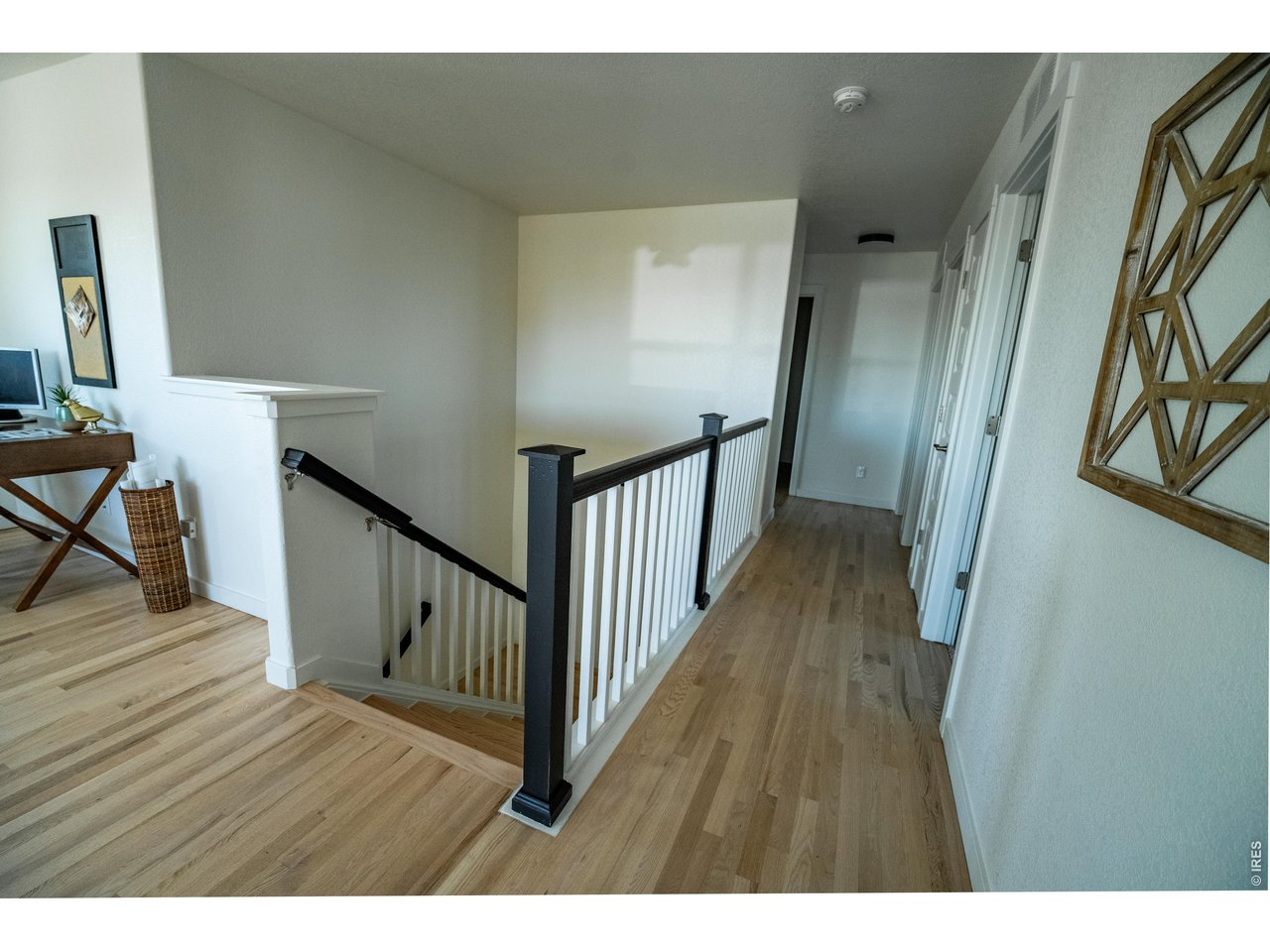 7905 West 11th St Road Greeley, CO 80634 - Photo 21 of 34 Staircase to upper level and hallway