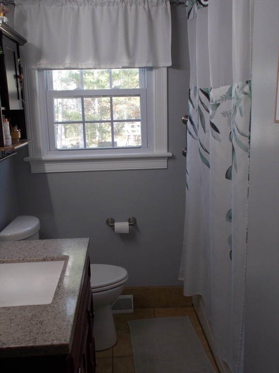 146 South Meadow Road Carver, MA 02330 - Photo 9 of 15 a bathroom with a sink toilet and window