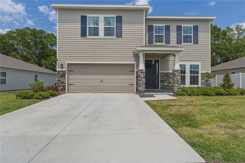 17664 Northwest 173rd Road Alachua, FL 32615 - Photo 1 of 31 front view of a house with a yard