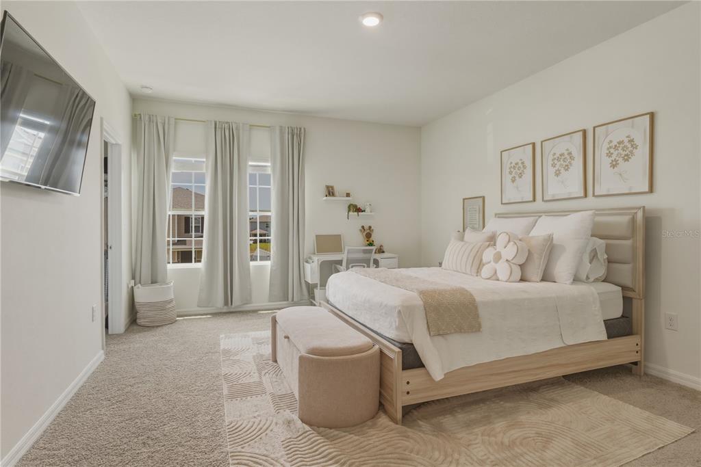 17664 Northwest 173rd Road Alachua, FL 32615 - Photo 13 of 31 a bedroom with a large bed and glass door