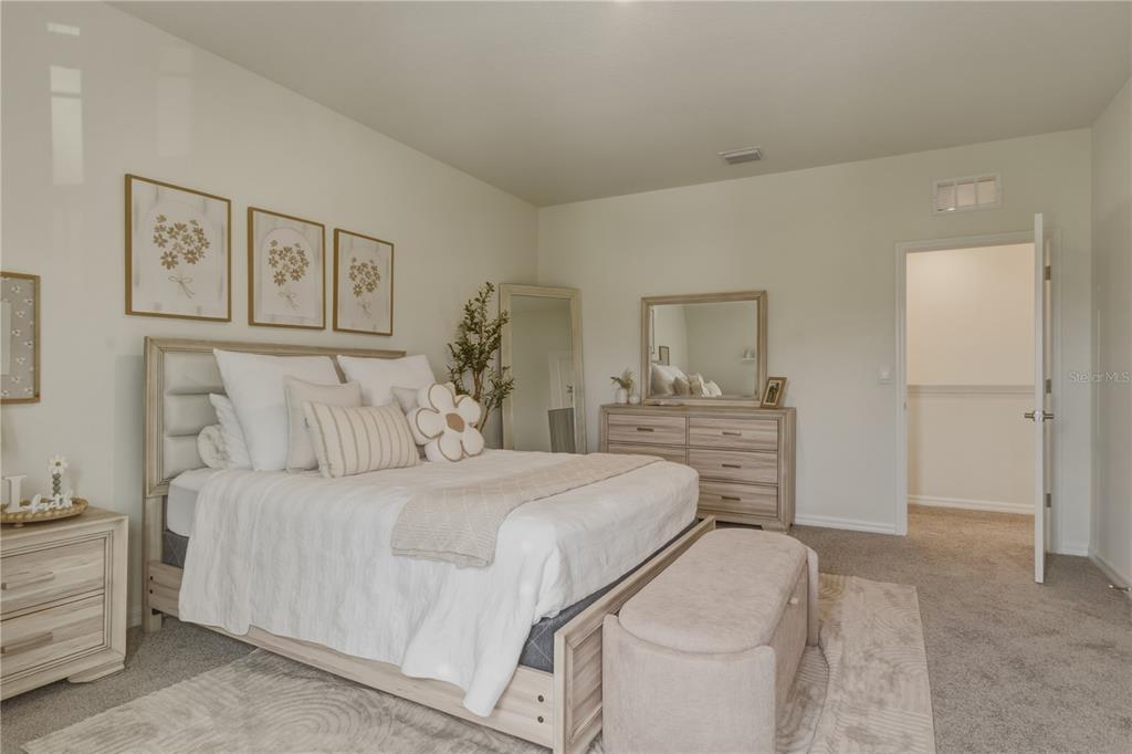 17664 Northwest 173rd Road Alachua, FL 32615 - Photo 14 of 31 a bedroom with a bed and a cabinets