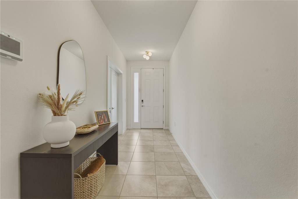 17664 Northwest 173rd Road Alachua, FL 32615 - Photo 2 of 31 a view of entryway with kitchen