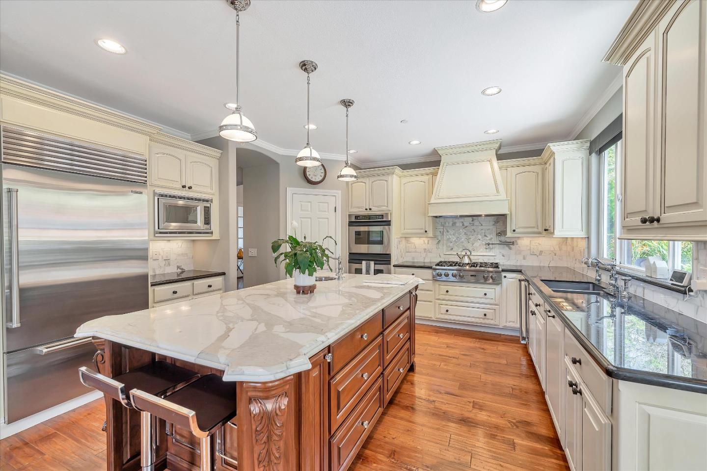 2380 Sunflower Circle Gilroy, CA 95020 - Photo 14 of 43 a kitchen with granite countertop a sink a counter space appliances and cabinets
