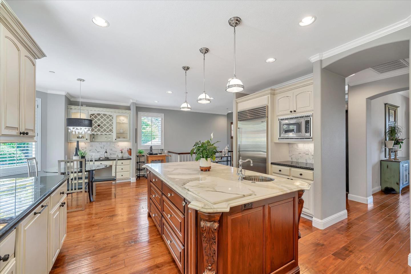 2380 Sunflower Circle Gilroy, CA 95020 - Photo 15 of 43 a large kitchen with kitchen island a large island in it