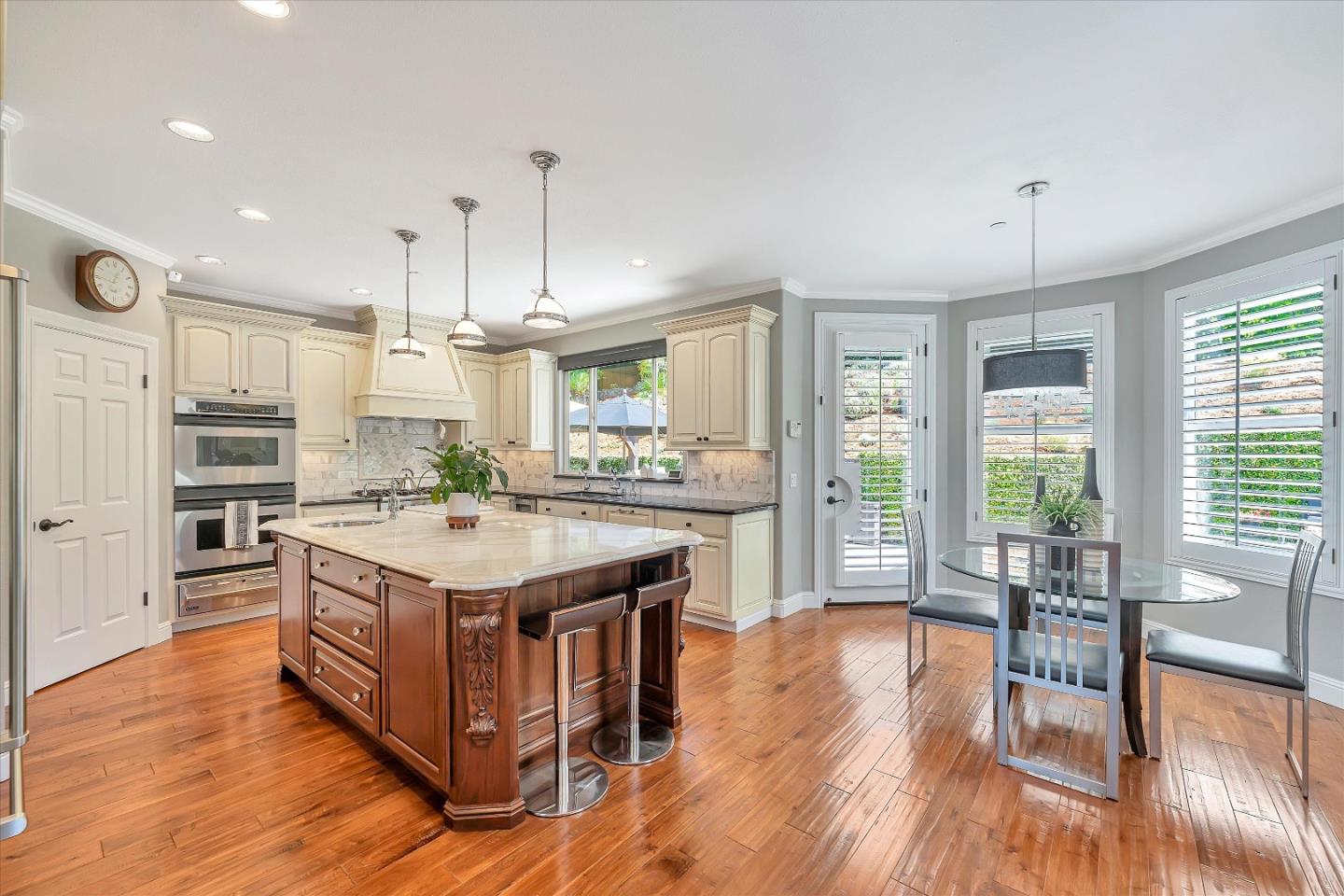 2380 Sunflower Circle Gilroy, CA 95020 - Photo 16 of 43 a kitchen with a stove and chairs