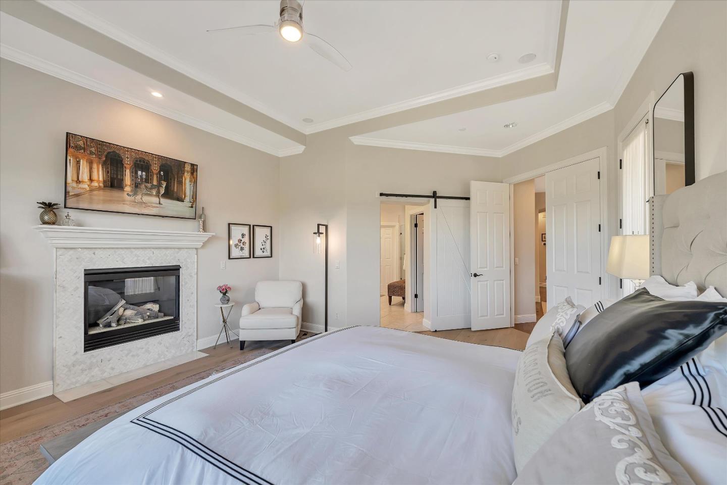 2380 Sunflower Circle Gilroy, CA 95020 - Photo 25 of 43 a bedroom with a bed and a fireplace