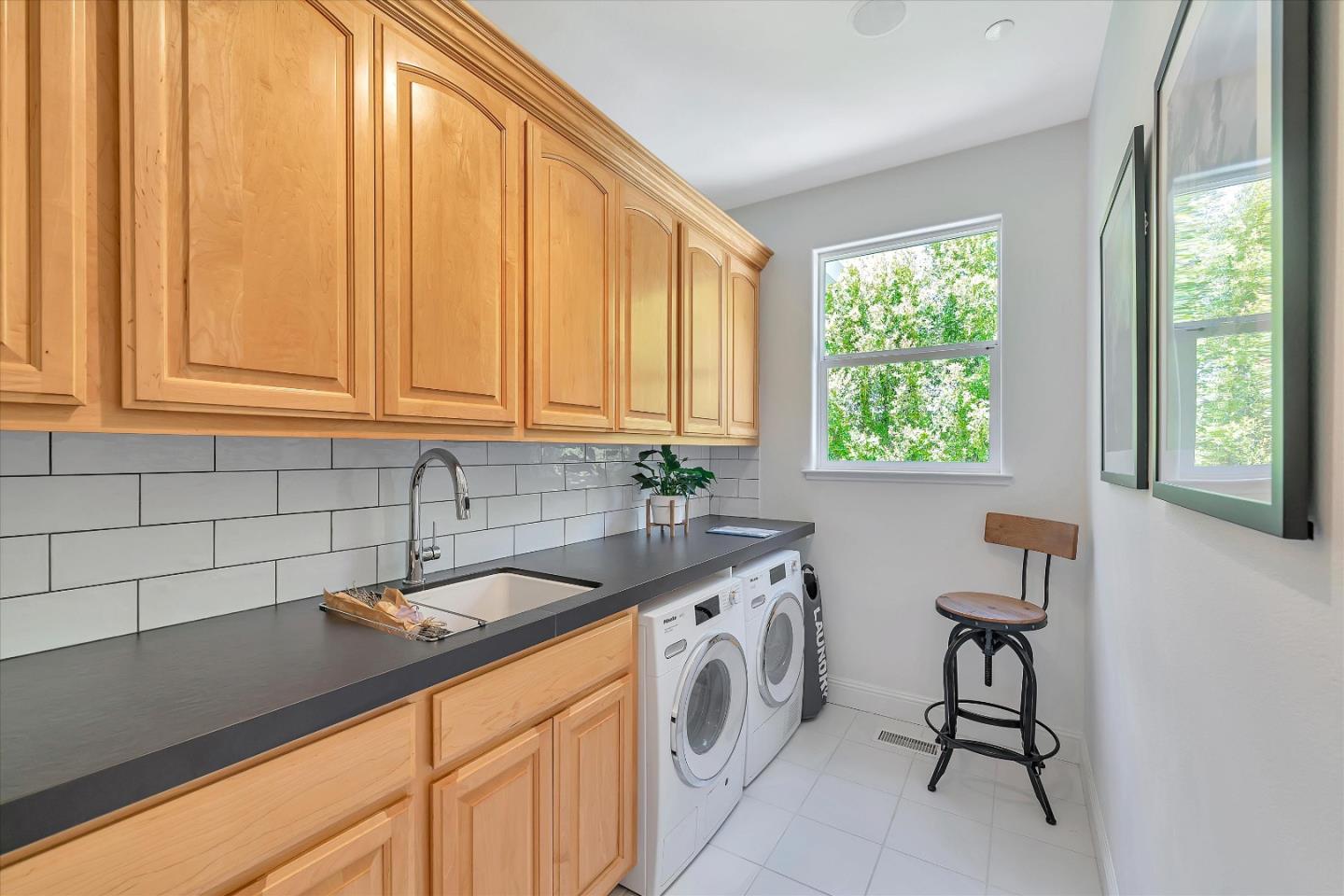 2380 Sunflower Circle Gilroy, CA 95020 - Photo 29 of 43 a utility room with a sink a cabinetry and a window
