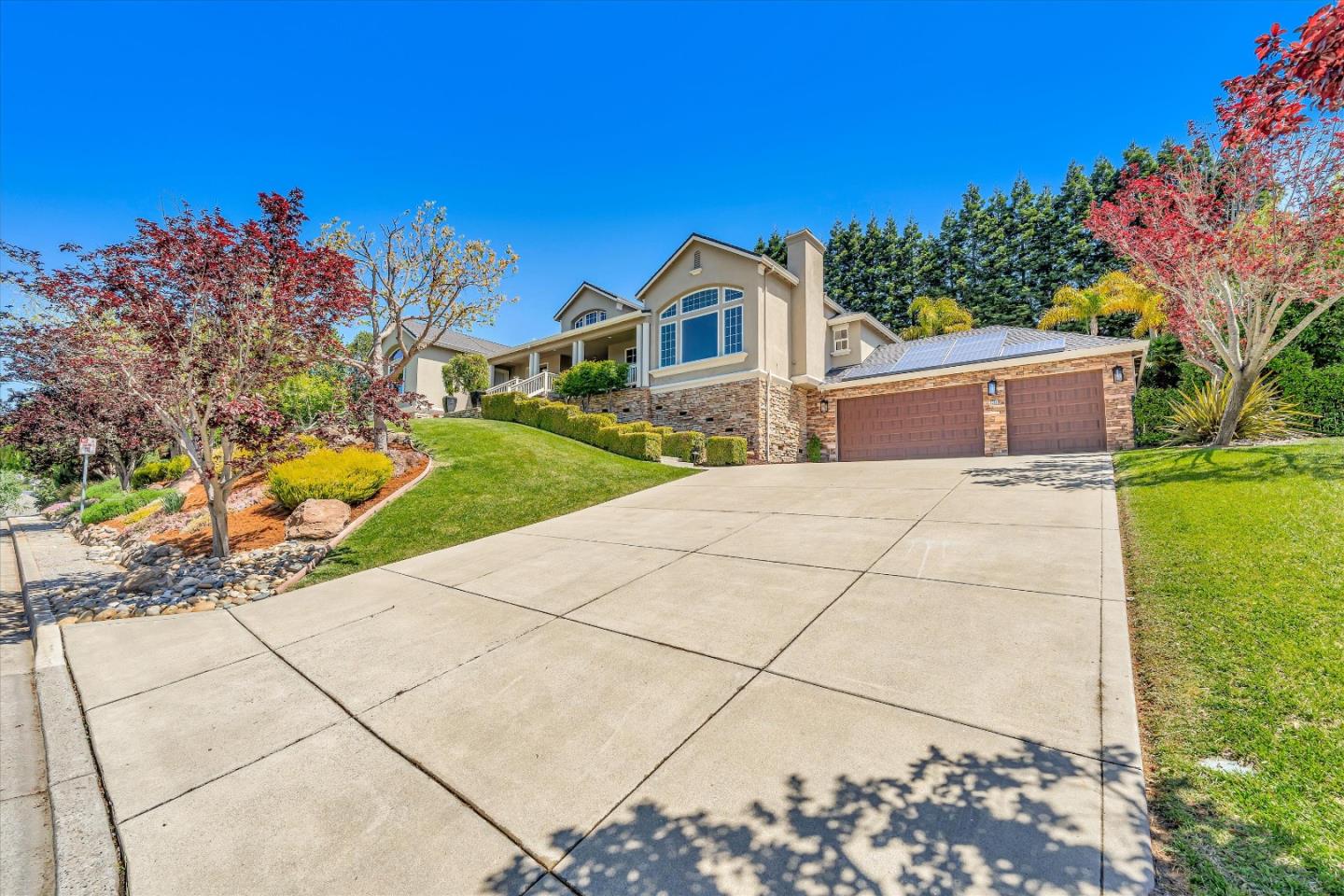 2380 Sunflower Circle Gilroy, CA 95020 - Photo 4 of 43 a front view of a house with a yard and garage