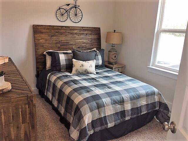 2412 Dakota Way Crestview, FL 32536 - Photo 19 of 30 a bed sitting in a bedroom next to a window