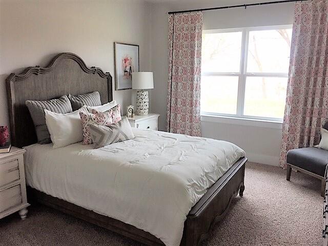 2412 Dakota Way Crestview, FL 32536 - Photo 23 of 30 a large bed sitting in a bedroom next to a window