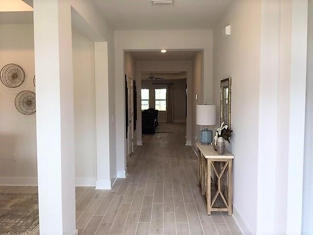 2412 Dakota Way Crestview, FL 32536 - Photo 2 of 30 a view of a hallway with wooden floor and a living room