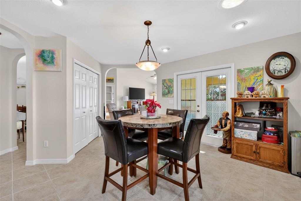 12193 Southeast 175th Loop Summerfield, FL 34491 - Photo 17 of 34 a view of a dining room with furniture and a chandelier