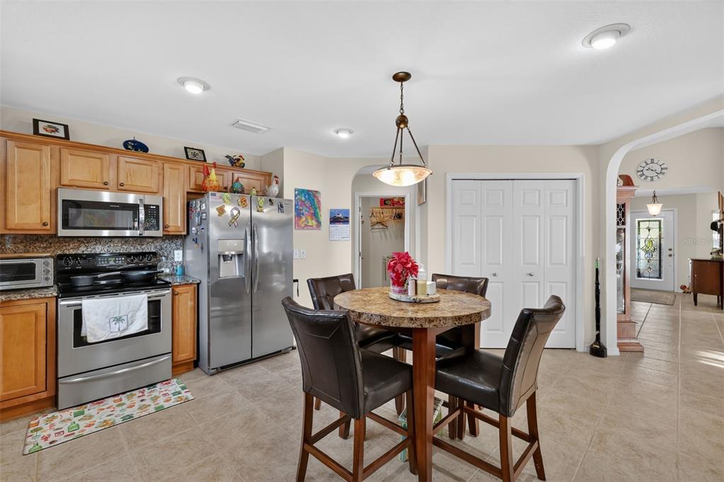 12193 Southeast 175th Loop Summerfield, FL 34491 - Photo 18 of 34 a view of a dining room and chandelier