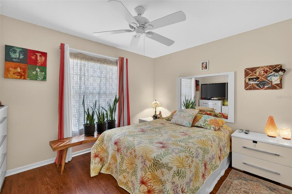 12193 Southeast 175th Loop Summerfield, FL 34491 - Photo 19 of 34 a bedroom with a bed and a chandelier