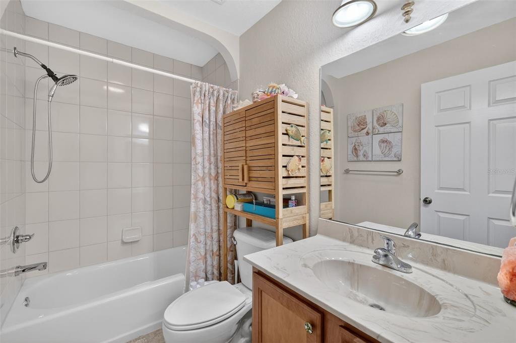 12193 Southeast 175th Loop Summerfield, FL 34491 - Photo 20 of 34 a bathroom with a sink toilet and shower