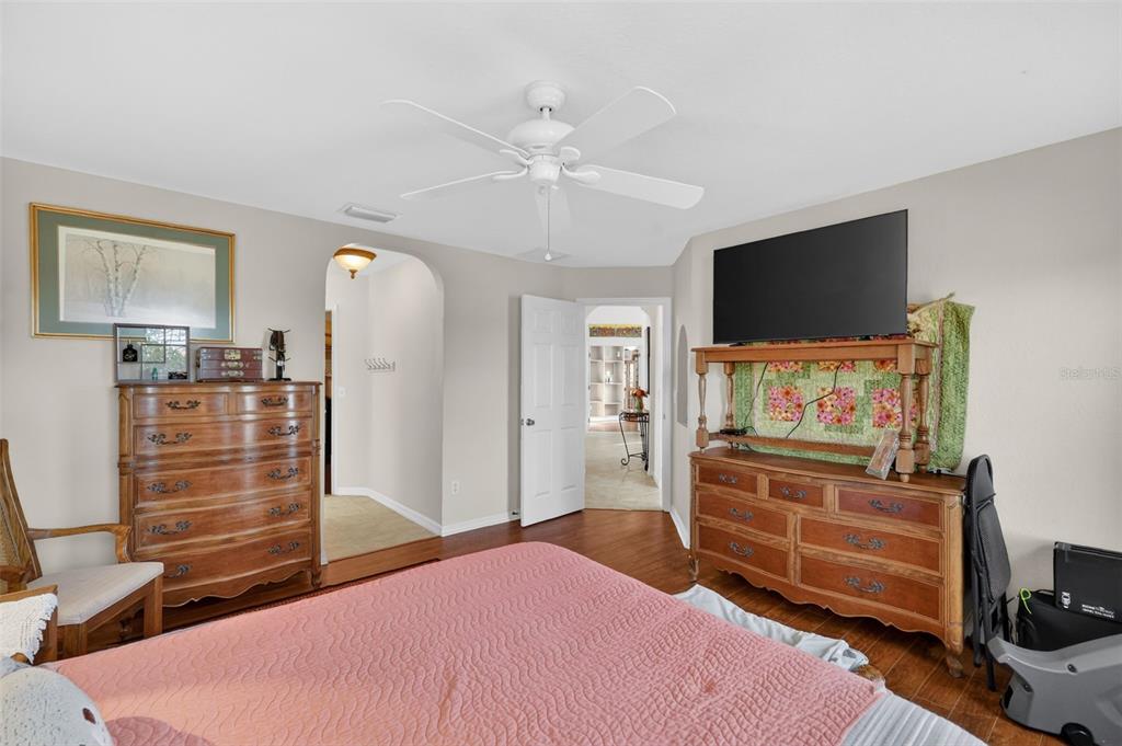 12193 Southeast 175th Loop Summerfield, FL 34491 - Photo 22 of 34 a bedroom with a bed and a flat screen tv