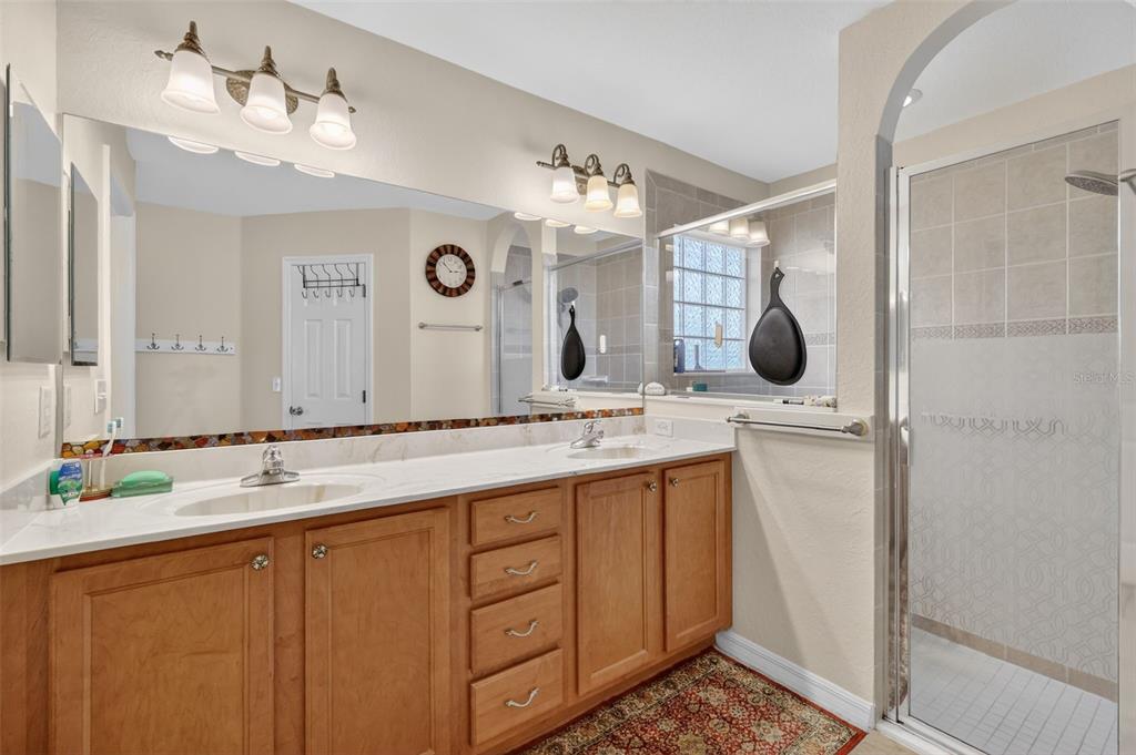 12193 Southeast 175th Loop Summerfield, FL 34491 - Photo 23 of 34 a bathroom with a sink and a mirror