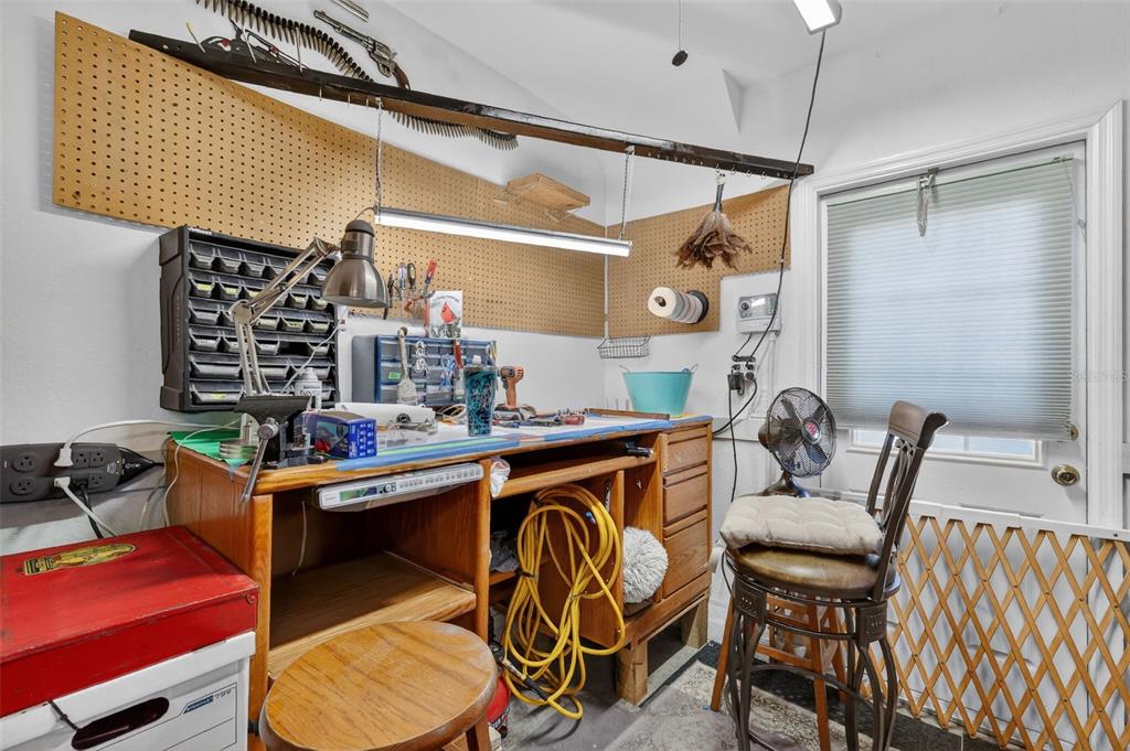12193 Southeast 175th Loop Summerfield, FL 34491 - Photo 27 of 34 a room with stainless steel appliances kitchen island granite countertop furniture and a wooden floor