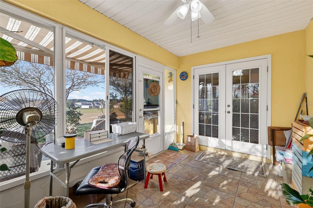 12193 Southeast 175th Loop Summerfield, FL 34491 - Photo 29 of 34 a room with furniture large window and flat screen tv