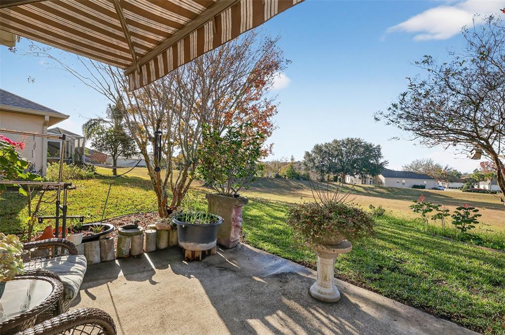 12193 Southeast 175th Loop Summerfield, FL 34491 - Photo 30 of 34 a view of a lake with couches and wooden floor