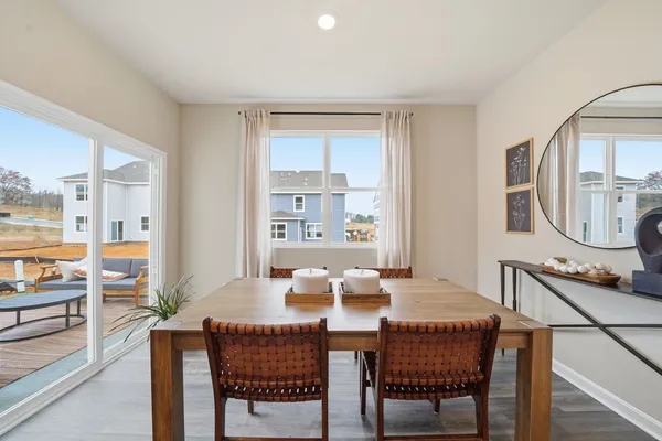 a dining room with furniture and window