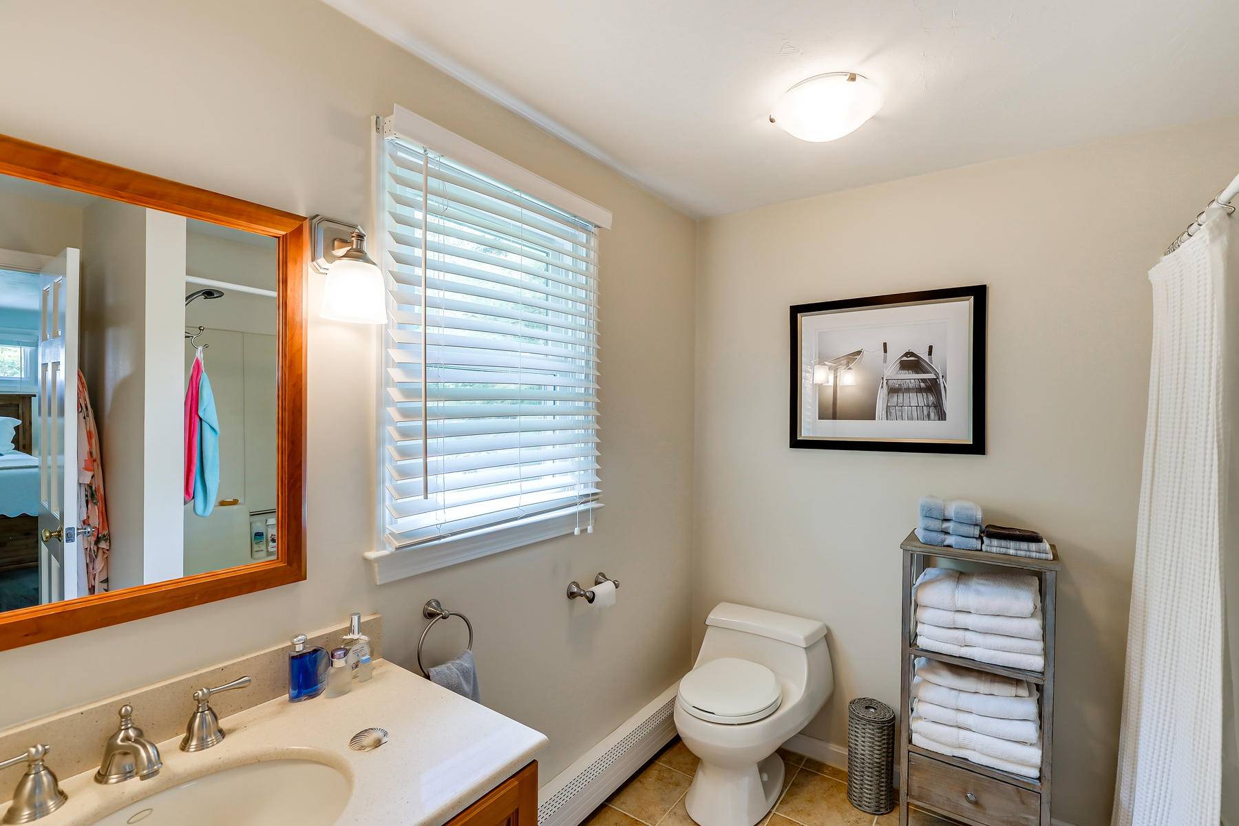 44 Spring Hill Road North Chatham, MA 02650 - Photo 26 of 40 a bathroom with a toilet a sink and a mirror