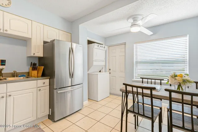 a kitchen with appliances cabinets and furniture