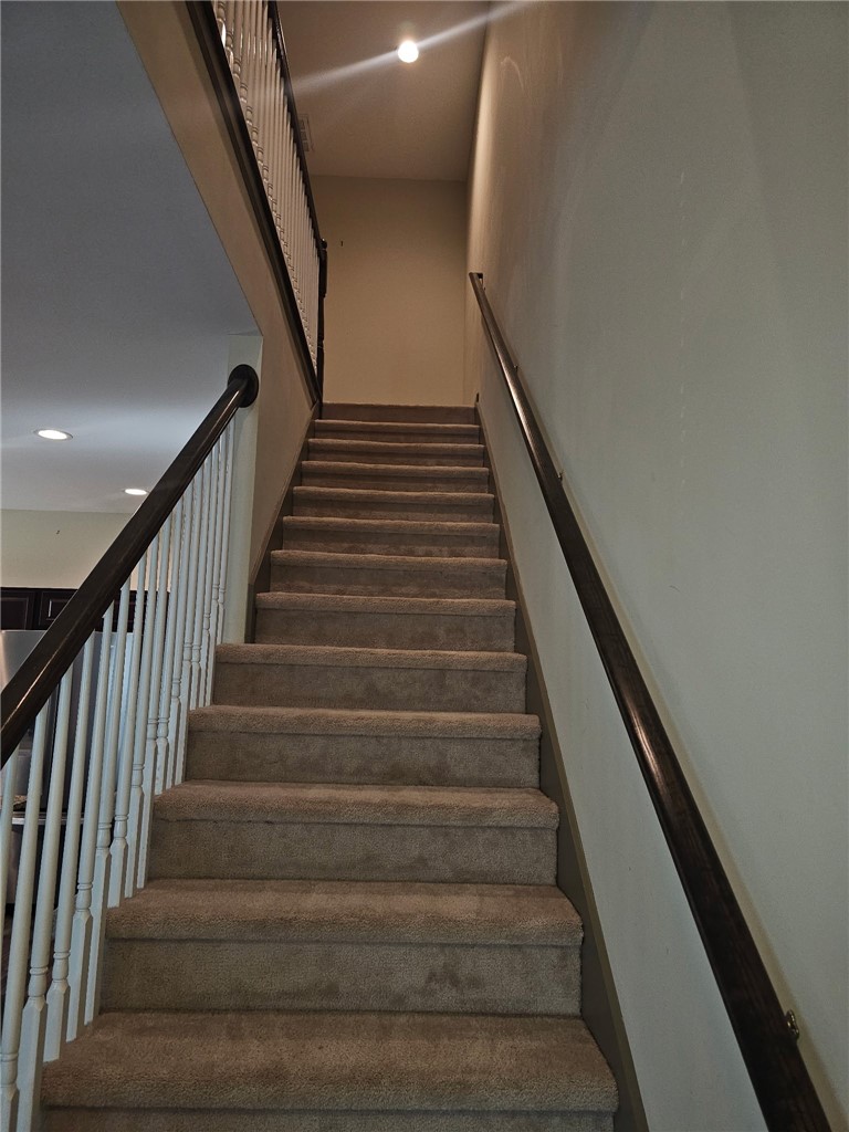 235 Pendleton Road Clemson, SC 29631 - Photo 20 of 21 This carpeted staircase connects two levels, offering a welcoming transition within the home.