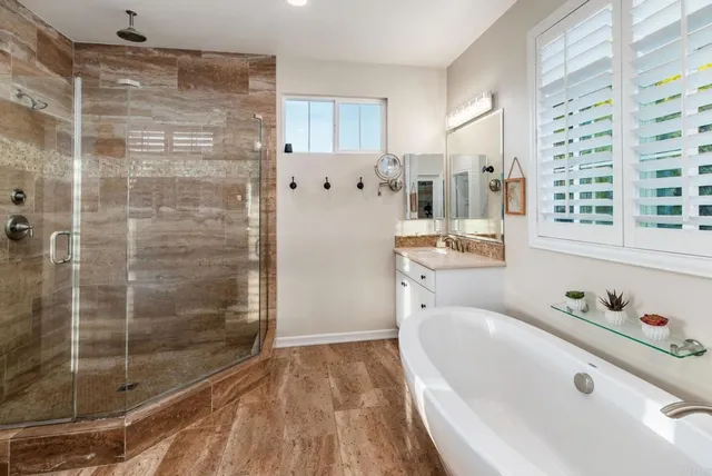a bathroom with a bathtub and a shower