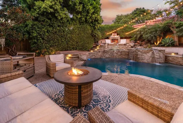 a view of a backyard with sitting area