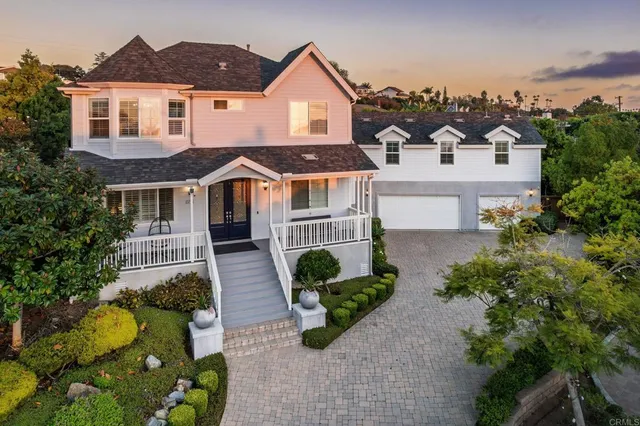 an aerial view of a house with yard and plants