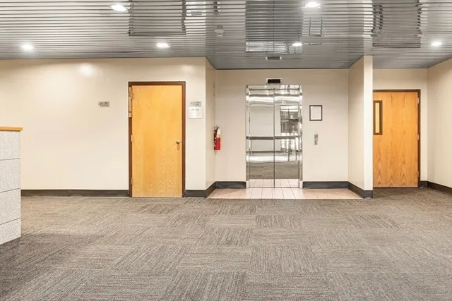 a view of a living room with a large window