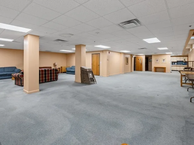 a kitchen with stainless steel appliances a refrigerator sink and cabinets