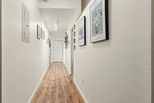 a view of a hallway with stairs