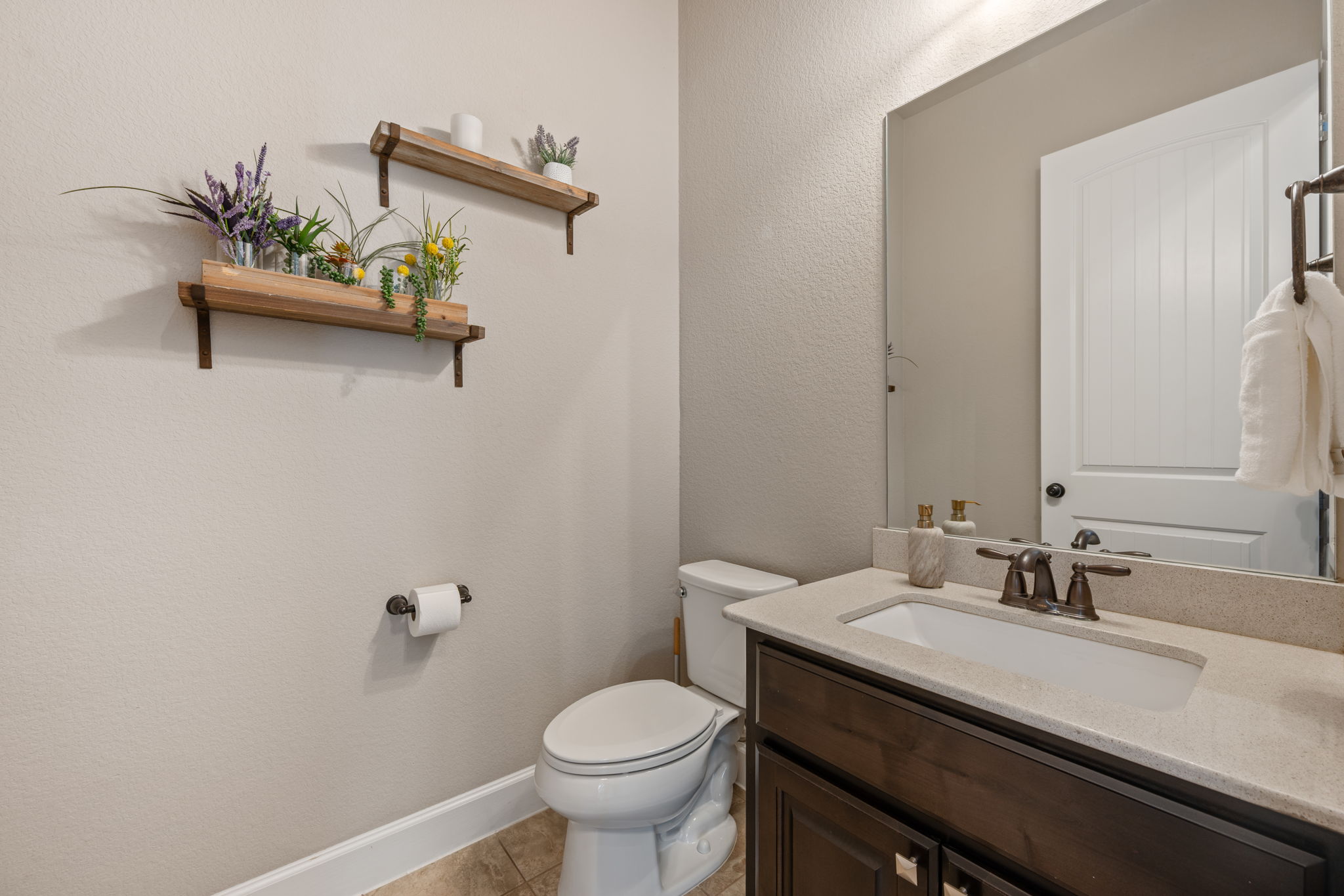 4118 Capora Way Round Rock, TX 78681 - Photo 19 of 39 a bathroom with a granite countertop sink and a toilet