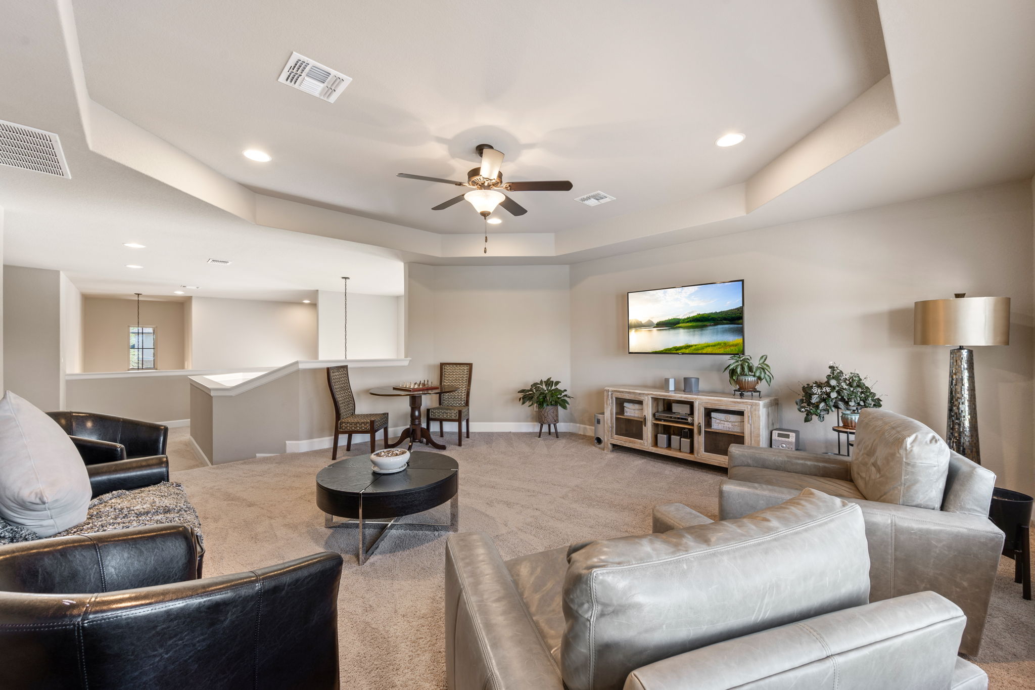 4118 Capora Way Round Rock, TX 78681 - Photo 22 of 39 a living room with furniture a lamp and a chandelier