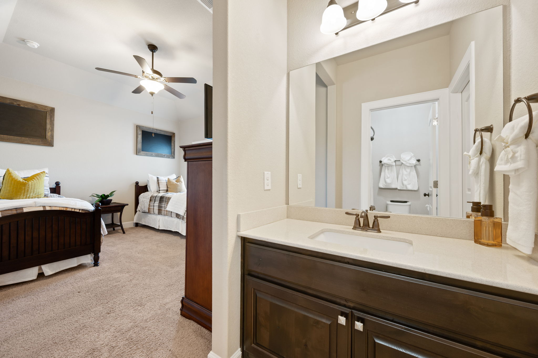 4118 Capora Way Round Rock, TX 78681 - Photo 26 of 39 a en suite bathroom with a double vanity sink and a mirror