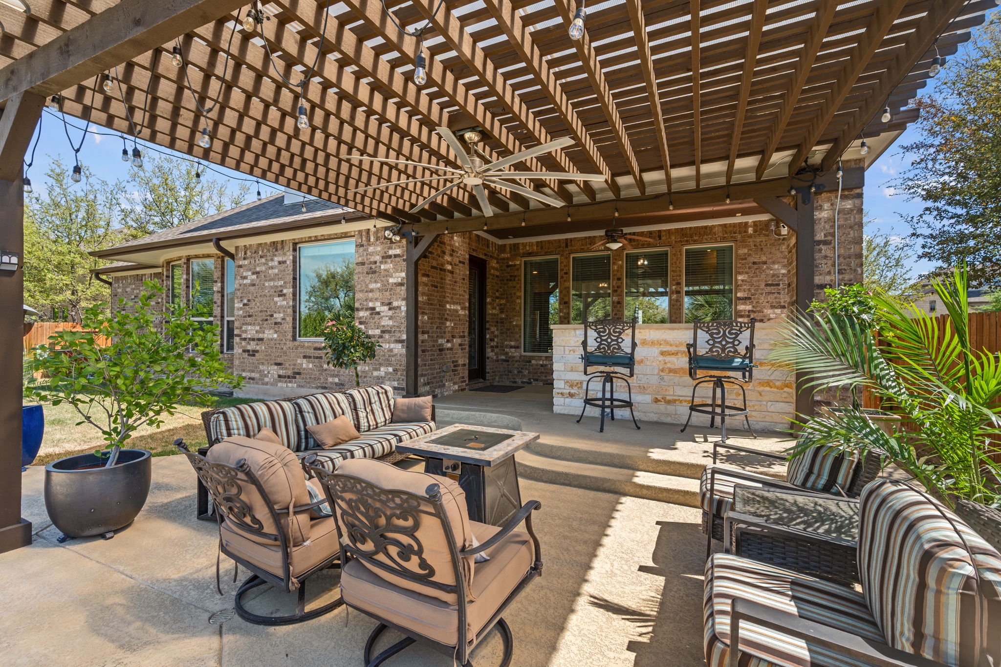 4118 Capora Way Round Rock, TX 78681 - Photo 29 of 39 a building outdoor space with patio furniture and potted plants