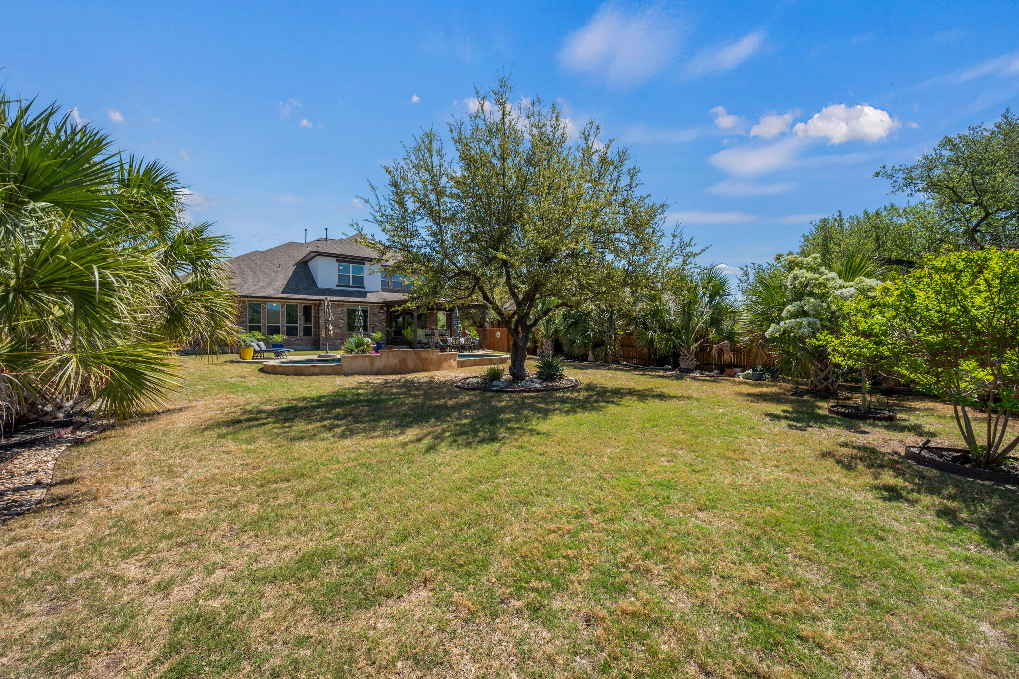4118 Capora Way Round Rock, TX 78681 - Photo 36 of 39 a view of a swimming pool with an outdoor seating and a yard