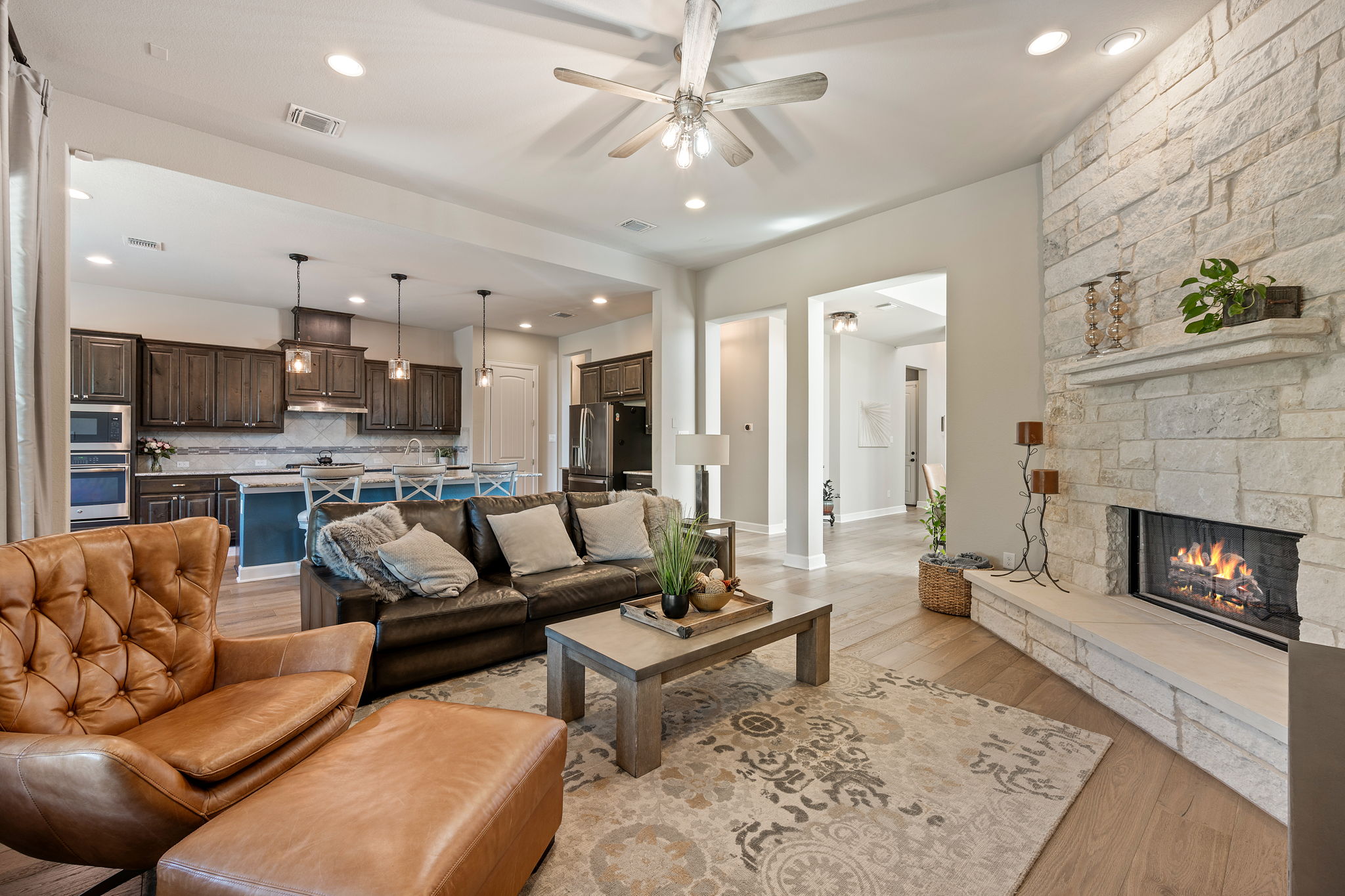 4118 Capora Way Round Rock, TX 78681 - Photo 6 of 39 a living room with furniture and a fireplace