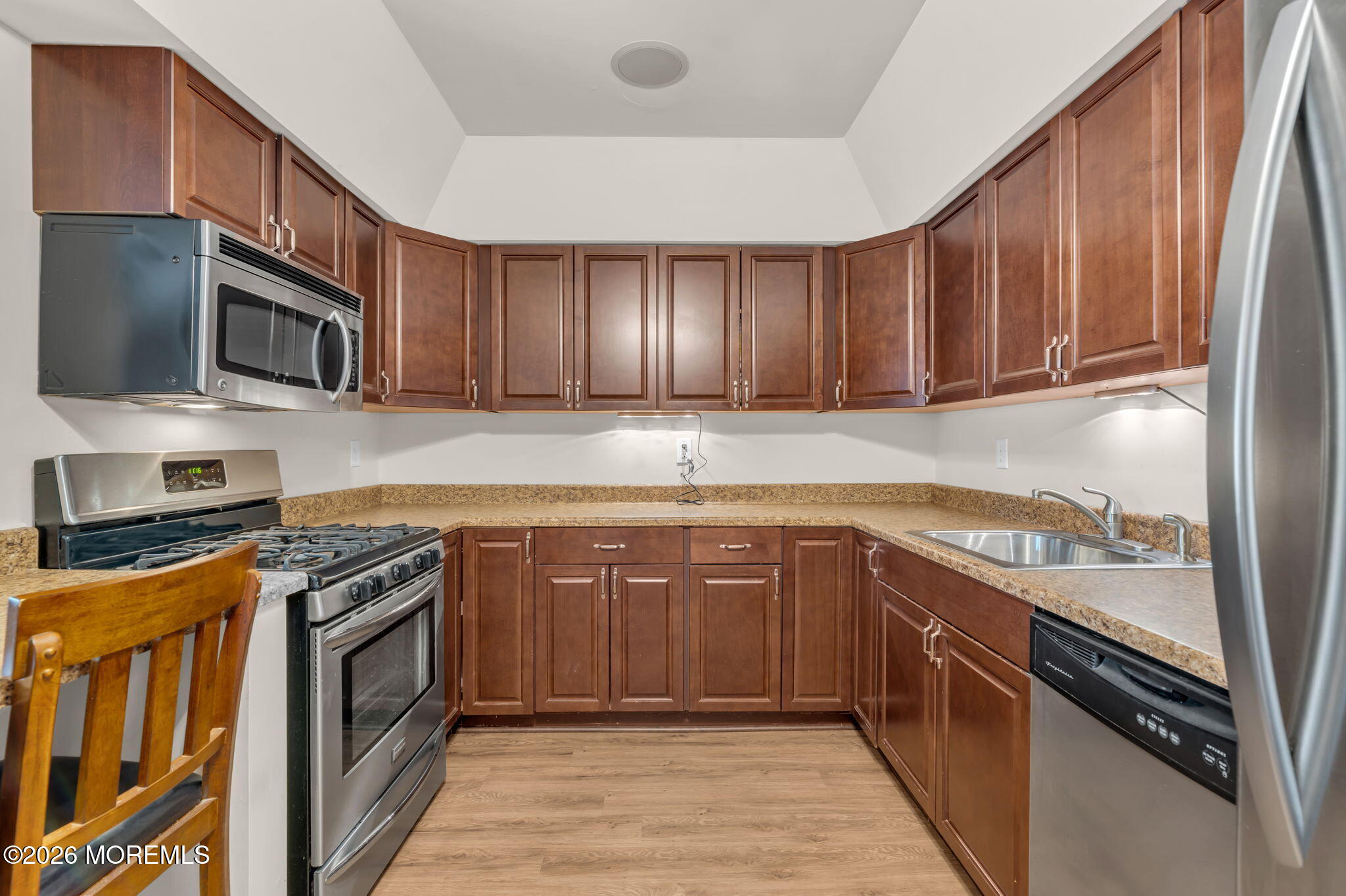 72 Kingsley Way Freehold, NJ 07728 - Photo 14 of 36 a kitchen with stainless steel appliances granite countertop wooden cabinets a stove top oven a sink and dishwasher